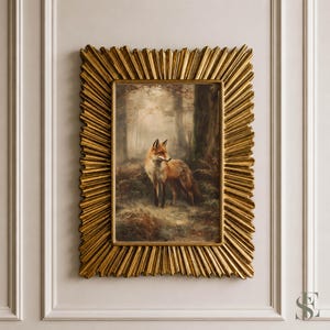 May include: A rectangular wall art piece featuring a painting of a red fox standing in a misty forest. The artwork is enclosed in a wide, textured gold frame with a sunburst or starburst design radiating outward from the central image.