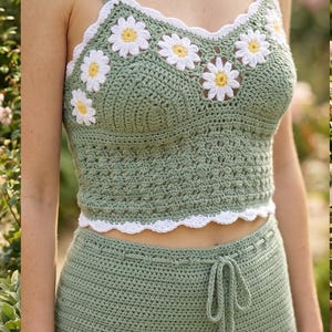 May include: A sage green crochet crop top featuring a scalloped white neckline adorned with white and yellow daisy flower motifs. The top has thick straps and a matching sage green crochet bottom with a drawstring waist and tassel details.