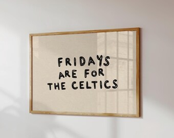 May include: A rectangular wall art piece in a light wooden frame featuring a beige background with the black hand-drawn text FRIDAYS ARE FOR THE CELTICS centered on the print. The design uses a casual, bold, and rounded typeface style.