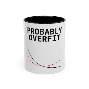 May include: White ceramic coffee mug with a black interior. The mug features the text "PROBABLY OVERFIT" in bold black letters. Below the text are two curved lines, one solid black and one dashed red.