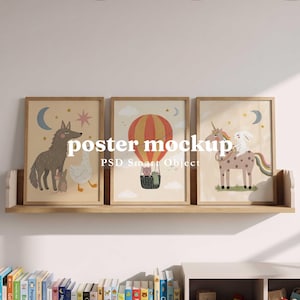 May include: Three framed posters with light wood frames resting on a wooden shelf. The left poster shows a wolf, mouse, and bird. The center poster features a hot air balloon. The right poster depicts a unicorn and rabbit. Text reads poster mockup.