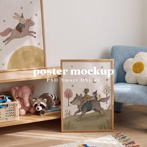 May include: Two framed vertical posters featuring whimsical animal illustrations. The left poster shows a rabbit riding a unicorn, while the right poster depicts a wolf carrying a duck and a mouse. The text "By Barakaya" and "poster mockup PSD Smart Object" is visible.