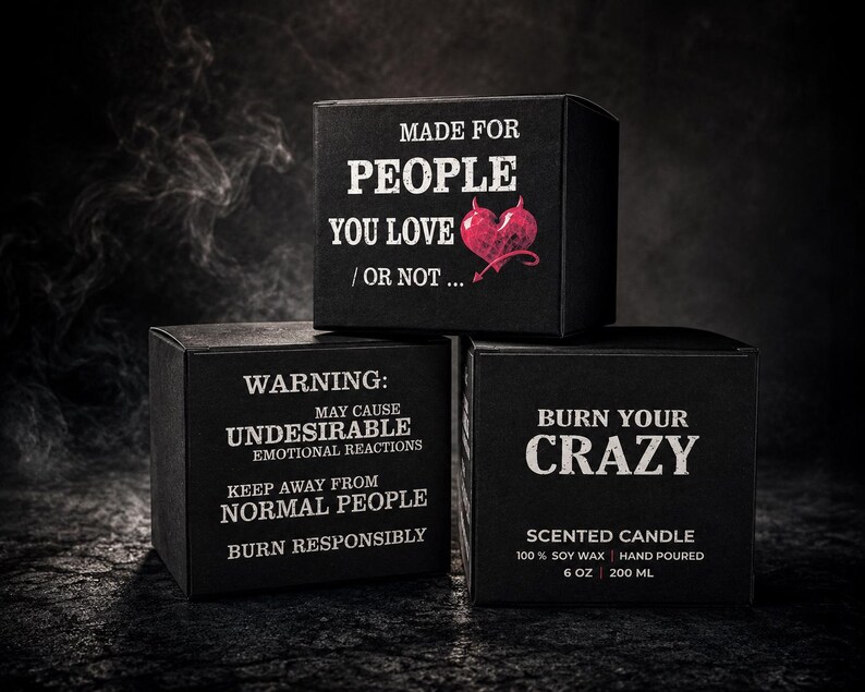 Puede incluir: Tres cajas cuadradas negras con texto blanco y un coraz&oacute;n rojo. Las cajas dicen "MADE FOR PEOPLE YOU LOVE / OR NOT...", "WARNING: MAY CAUSE UNDESIRABLE EMOTIONAL REACTIONS KEEP AWAY FROM NORMAL PEOPLE BURN RESPONSIBLY", y "BURN YOUR CRAZY".