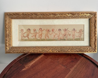 Lámina vintage enmarcada en oro: La danza de los querubines o el festival de Cupido, de M. Delecrolk.