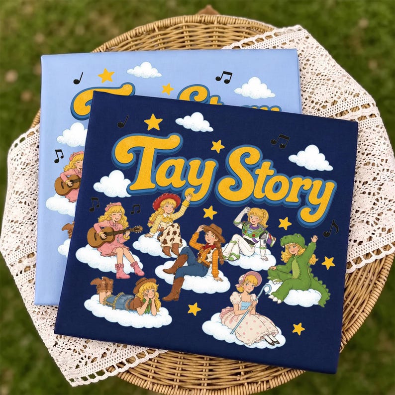 May include: A dark blue rectangular canvas print featuring the text Tay Story in yellow with a blue outline. The design includes multiple illustrations of a blonde character dressed in various costumes sitting on white clouds with yellow stars.
