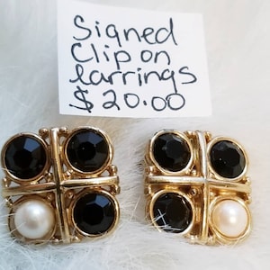 Signed Monet vintage clip on earrings, black and goldtone