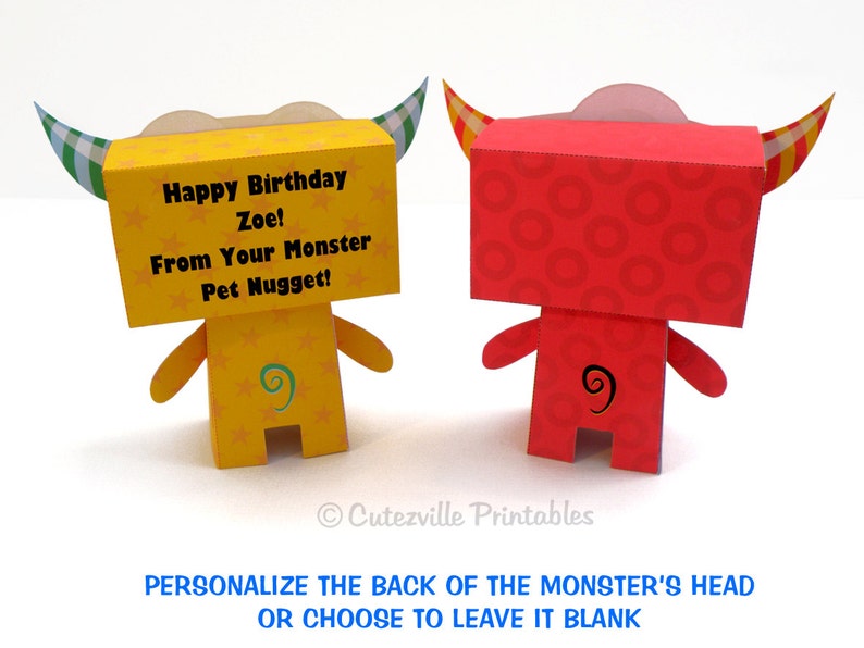 May include: A printable papercraft monster with a yellow body and green horns. The monster has a message on its head that says "Happy Birthday Zoe! From Your Monster Pet Nugget!"
