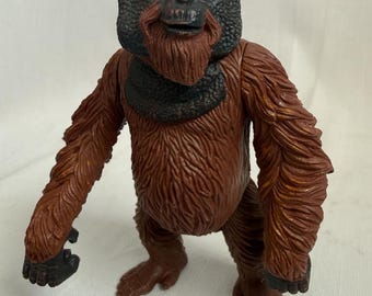 Statuetta di orango in stile vintage, in plastica, con braccia mobili, alta 14 cm.