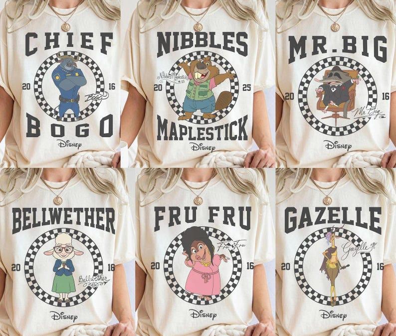 May include: Cream-colored t-shirts featuring cartoon characters from the movie Zootopia. Each shirt displays a character's name and image within a checkered circle. The characters include Chief Bogo, Nibbles Maplestick, Mr. Big, Bellwether, Fru Fru, and Gazelle.