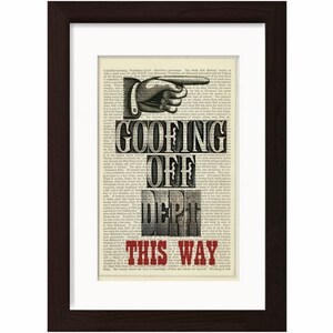 May include: A vintage-style print with a black and white illustration of a hand pointing right. The text "GOOFING OFF DEPT. THIS WAY" is in red and black letters.