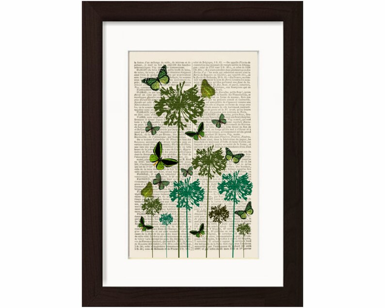 May include: A vintage book page with a green and black butterfly design. The butterflies are flying around green plants with a white background. The text on the page is in French.