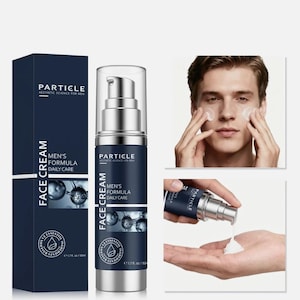 May include: A dark blue box and bottle of Particle Men's Formula Face Cream. The bottle has a silver pump and a clear cap. The box and bottle have white text that reads "Particle Aesthetic Science for Men" and "Men's Formula Daily Care". The image also shows a person applying the cream.