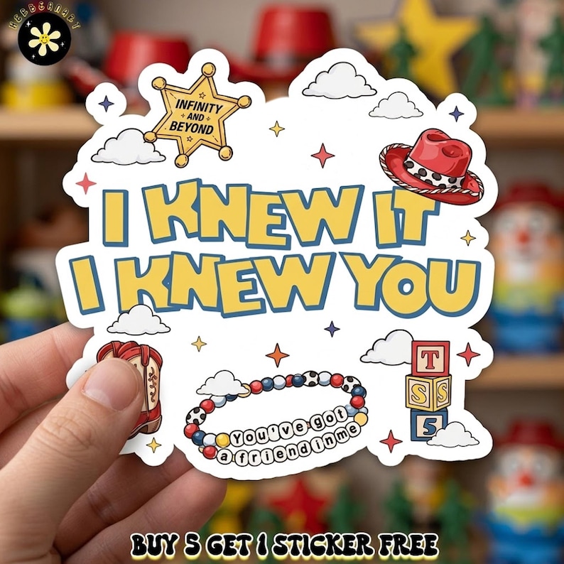May include: A white die-cut sticker featuring the yellow text I KNEW IT I KNEW YOU, a gold sheriff badge with the text INFINITY AND BEYOND, a red cowboy hat, a red boot, a beaded bracelet with the text You've got a friend in me, and blocks.