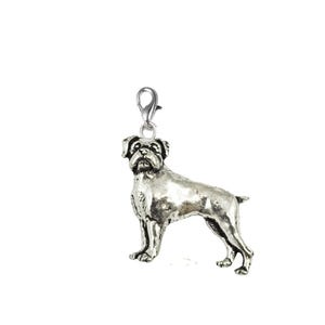 May include: A silver Boxer dog charm with a lobster clasp. The charm shows a standing Boxer dog with detailed features. The dog is facing forward, showcasing its muscular build and distinctive facial features. Suitable for jewellery making.
