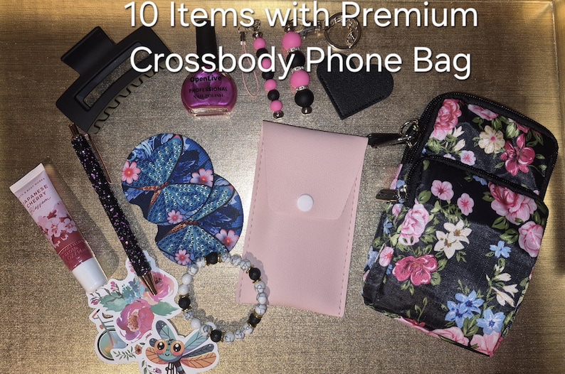 May include: A collection of 10 items including a floral crossbody phone bag, a pink pouch, a black hair clip, a bottle of pink nail polish, a glittery pen, two round coasters, a beaded bracelet, a keychain, and a sticker of a dragonfly.