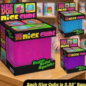 May include: A Nee Doh Nice Cube sensory toy in a black display box with bright pink and green text. The box features the words Nee Doh Nice Cube and Super Solid Squish. The cube inside is pink, and the packaging states it is 2.25 inches square.