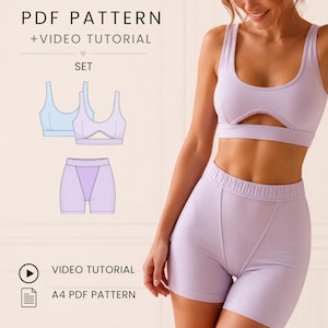 Può includere: Un set di cartamodello PDF e video tutorial per un completo a due pezzi color lavanda. Il set include un top sportivo a girocollo con apertura frontale e pantaloncini a vita alta con cuciture verticali. Testo incluso: PDF PATTERN.