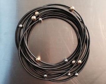 Piano Wire Bracelet Slate with silver and gold beads