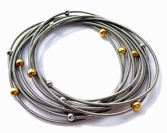 Piano Wire Bracelet Silver with silver and gold beads