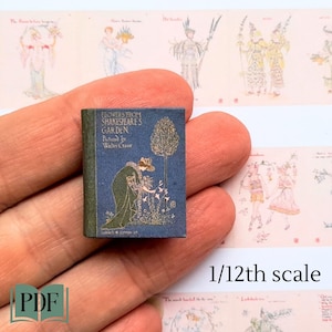 Peut inclure: Un livre miniature intitulé "Flowers from Shakespeare's Garden" illustré par Walter Crane. La couverture du livre présente un fond bleu avec une illustration dorée d'une femme en robe verte s'occupant de fleurs.