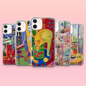 May include: A collection of five phone cases with colorful, artistic designs. The cases feature various abstract and Matisse-inspired artwork, including a yellow cat, fish, and vibrant patterns. The cases are displayed against a pink background.