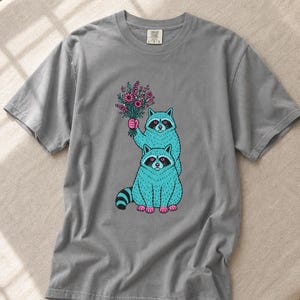 Two Raccoons Holding Wildflowers T-Shirt, Teal and Pink Riso Style Raccoon Tee, Cottagecore Animal Graphic Shirt, Soft Protest Gift image 13