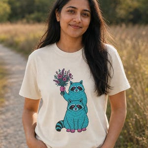 Two Raccoons Holding Wildflowers T-Shirt, Teal and Pink Riso Style Raccoon Tee, Cottagecore Animal Graphic Shirt, Soft Protest Gift image 2