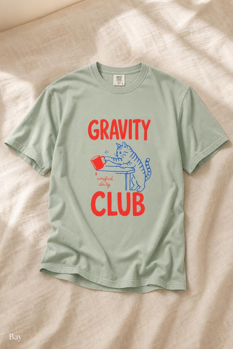 Gravity Club Cat T-Shirt Funny Cat Knocking Coffee Mug Off Table Tee Two Color Cat Lover Graphic Tee Gift imagem 5