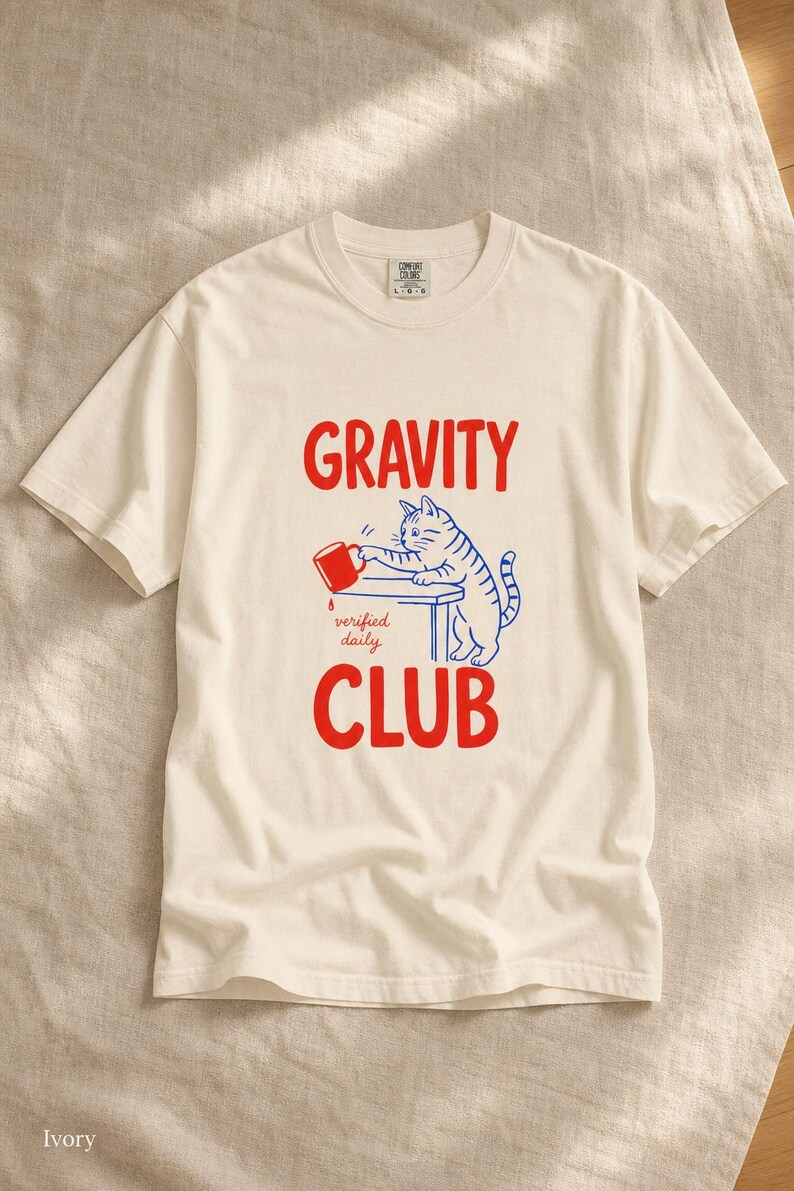 Gravity Club Cat T-Shirt Funny Cat Knocking Coffee Mug Off Table Tee Two Color Cat Lover Graphic Tee Gift imagem 1