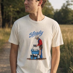 Steady Cowboy Washing Dishes T-Shirt, Mustached Ranch Hand at Blue Sink Graphic Tee, Quiet Work Western Shirt image 2