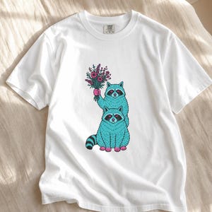 Two Raccoons Holding Wildflowers T-Shirt, Teal and Pink Riso Style Raccoon Tee, Cottagecore Animal Graphic Shirt, Soft Protest Gift image 4