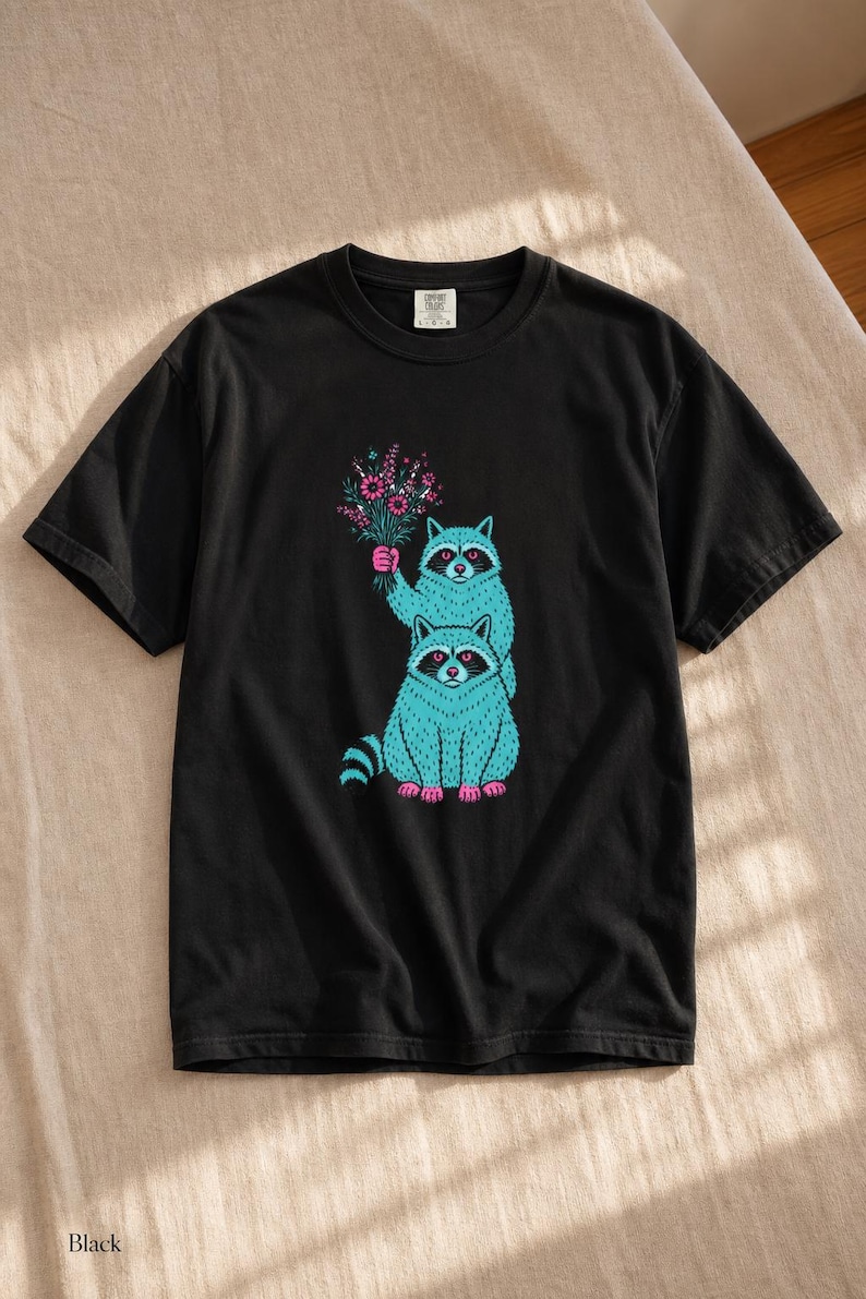 Two Raccoons Holding Wildflowers T-Shirt, Teal and Pink Riso Style Raccoon Tee, Cottagecore Animal Graphic Shirt, Soft Protest Gift image 1