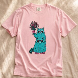 Two Raccoons Holding Wildflowers T-Shirt, Teal and Pink Riso Style Raccoon Tee, Cottagecore Animal Graphic Shirt, Soft Protest Gift image 7