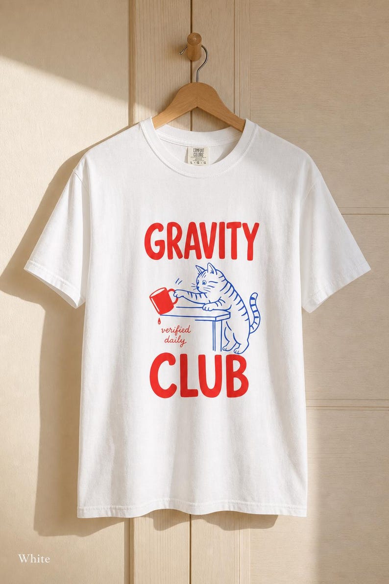 Gravity Club Cat T-Shirt Funny Cat Knocking Coffee Mug Off Table Tee Two Color Cat Lover Graphic Tee Gift imagem 4