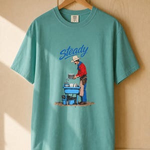 Steady Cowboy Washing Dishes T-Shirt, Mustached Ranch Hand at Blue Sink Graphic Tee, Quiet Work Western Shirt image 10