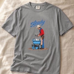 Steady Cowboy Washing Dishes T-Shirt, Mustached Ranch Hand at Blue Sink Graphic Tee, Quiet Work Western Shirt image 1