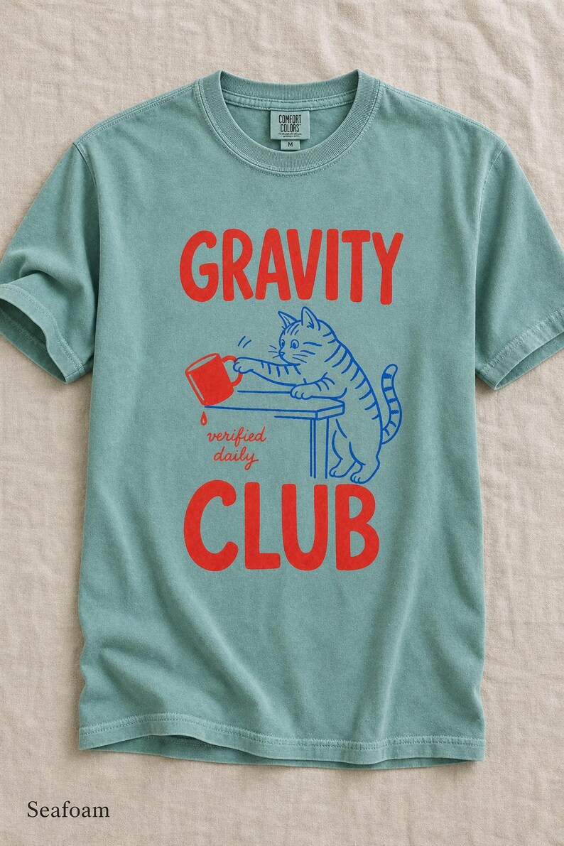 Gravity Club Cat T-Shirt Funny Cat Knocking Coffee Mug Off Table Tee Two Color Cat Lover Graphic Tee Gift imagem 9
