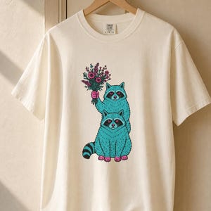 Two Raccoons Holding Wildflowers T-Shirt, Teal and Pink Riso Style Raccoon Tee, Cottagecore Animal Graphic Shirt, Soft Protest Gift image 6