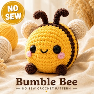 May include: A round, crocheted bumble bee plush toy with yellow and dark brown stripes, two white wings, black antennae, and black safety eyes. The bee has small pink cheeks and dark brown feet. A yellow circle in the corner reads NO SEW.