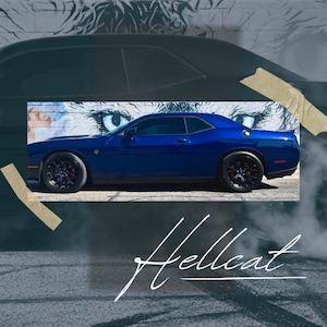 May include: A side profile of a deep blue two-door coupe with black multi-spoke wheels and red brake calipers. The car is positioned in front of a mural featuring a pair of eyes. The word Hellcat is written in white script at the bottom.