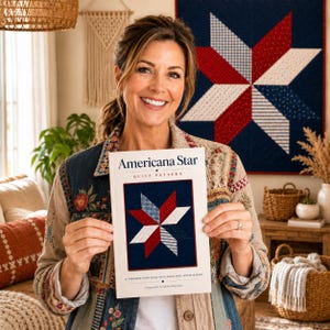 May include: A white instructional booklet titled Americana Star Quilt Pattern featuring a graphic of a red, white, and blue star quilt design on the cover. The booklet includes the text Americana Star Quilt Pattern and A Timeless Star Quilt in Classic Red, White & Blue.