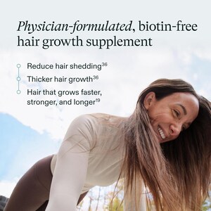 May include: A woman with long brown hair smiles in an image with text: Physician-formulated, biotin-free hair growth supplement. The text also mentions reducing hair shedding, thicker hair growth, and hair that grows faster, stronger, and longer.