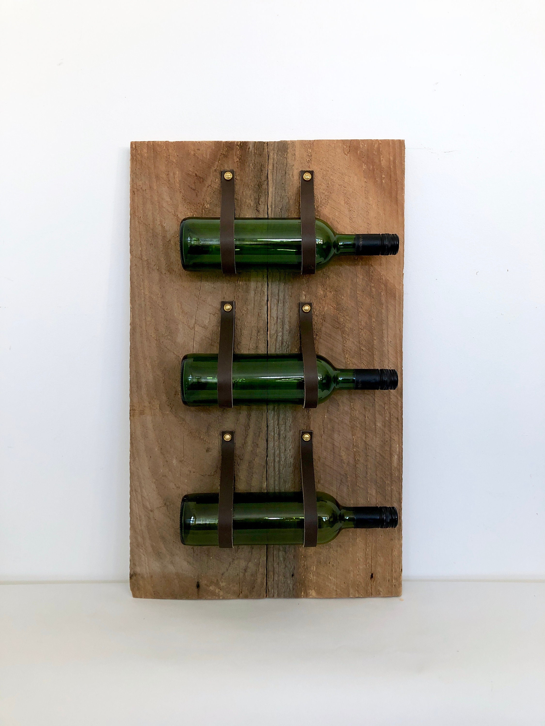 Wine rack with leather straps hot sale