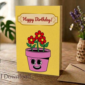 May include: A yellow birthday greeting card featuring a cartoon illustration of a pink flower pot with a smiling face and large eyes. The pot contains three red flowers with green stems and leaves. The text Happy Birthday is printed in red.