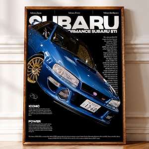 May include: A framed poster featuring a blue Subaru WRX STI car with gold wheels, set against a black background. The text includes SUBARU, PERFORMANCE SUBARU STI, ICONIC, and POWER, along with detailed technical specifications and history.