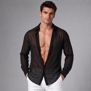 May include: A black long-sleeved shirt made of a sheer, semi-transparent fabric with a classic collar, a button-down front, and solid black cuffs. The shirt is worn unbuttoned, revealing a lightweight, breathable texture throughout the garment.