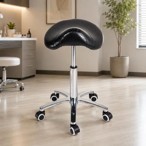 May include: A black saddle stool with a curved, padded seat and a chrome-finished metal base. The stool features a central adjustable height column and five legs, each equipped with a smooth-rolling caster wheel for mobility and stability.