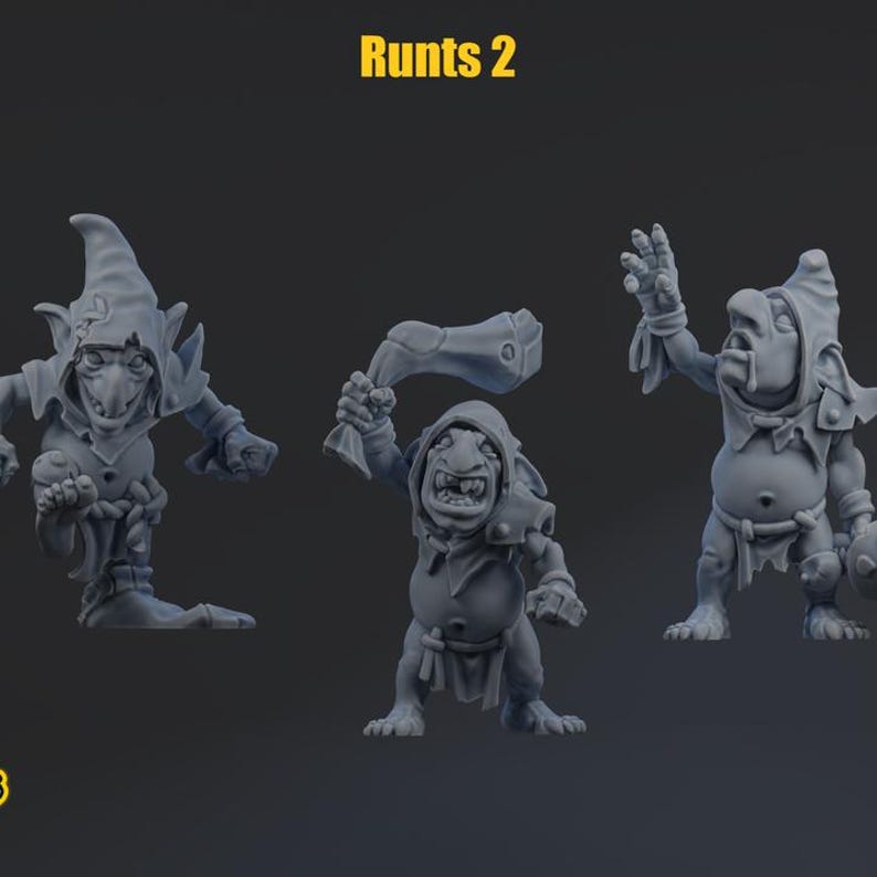 May include: Three grey miniature goblin figures labeled Runts 2. The left figure wears a pointed hood and stands with one foot raised. The center figure holds a large club overhead. The right figure has one arm raised and wears a hooded tunic.