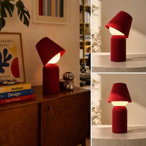 May include: A table lamp featuring a cylindrical red base, a spherical white glass light diffuser, and an adjustable red conical shade. The lamp is shown in three different configurations, displaying the shade at various angles and positions.