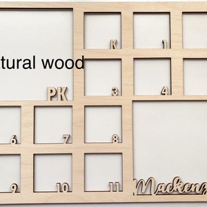 May include: Natural wood picture frame with 11 numbered squares and the name Mackenzie. The frame is made of natural wood and has a light brown color.